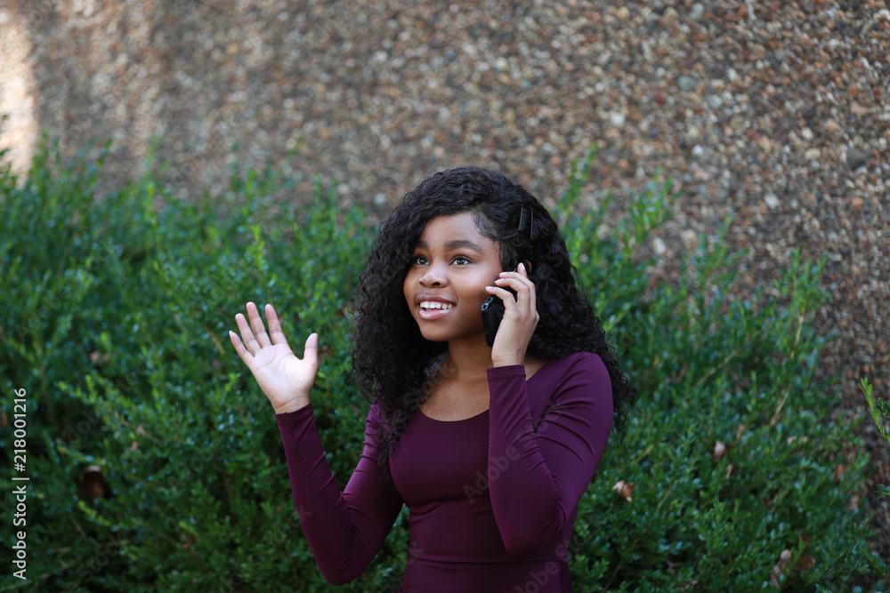 Astonished black female speaking on phone Astonished black female speaking on phone