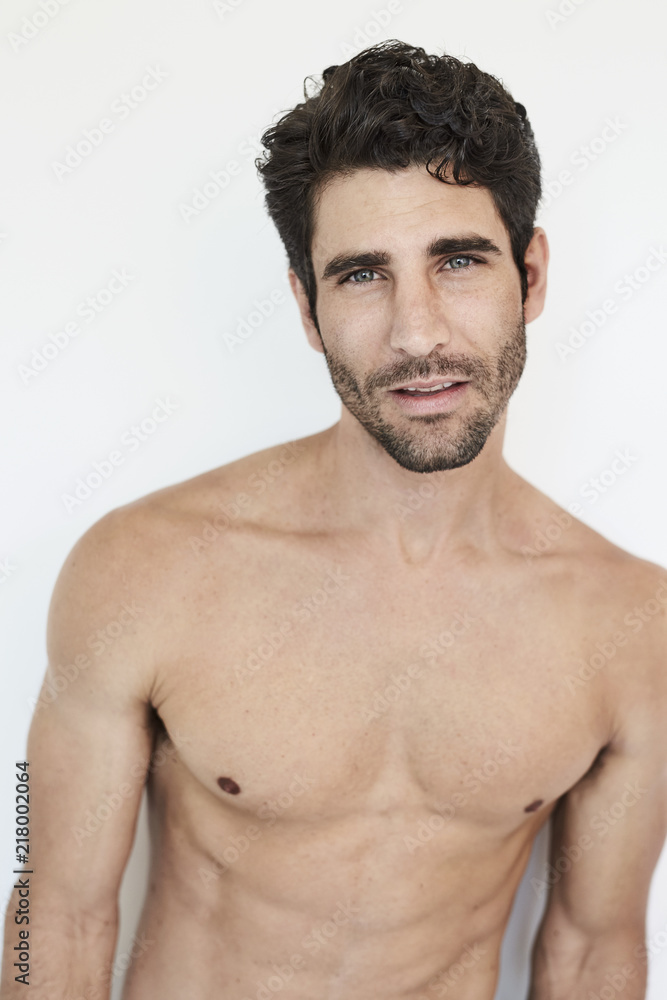 Fototapeta premium Hunky shirtless guy looking to camera