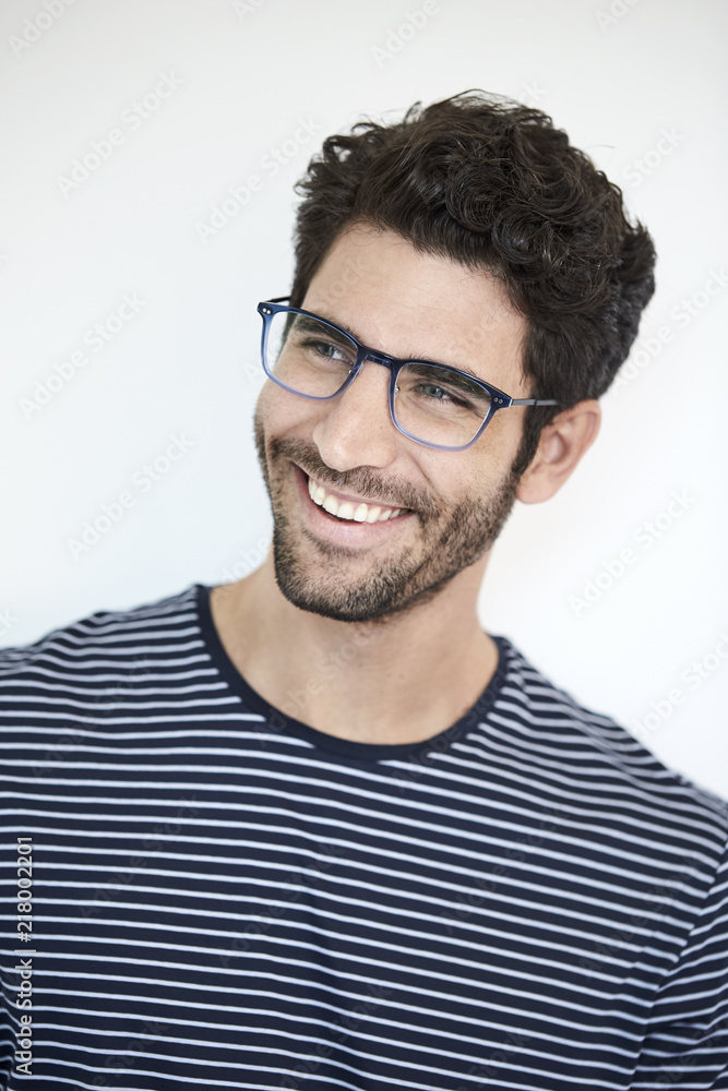 Smiling guy in striped top, studio Smiling guy in striped top, studio