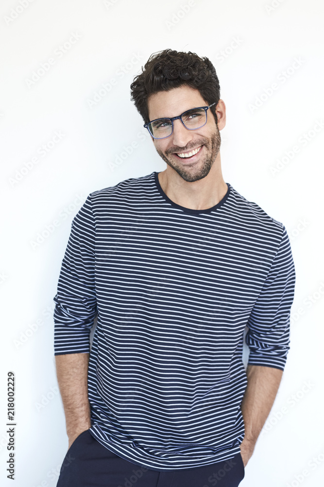 Guy in striped top and glasses, smiling Guy in striped top and glasses, smiling