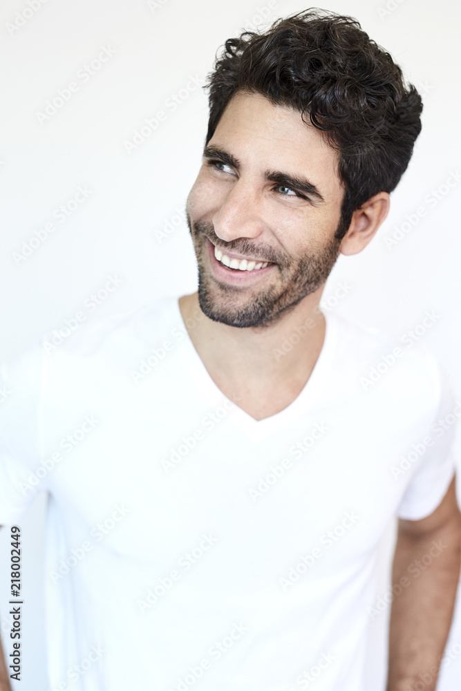Grinning guy in white t-shirt, studio Grinning guy in white t-shirt, studio