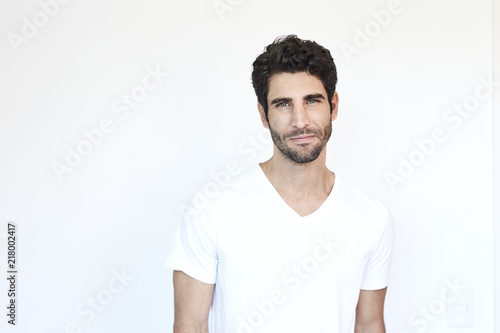 Handsome hunk in white t-shirt, portrait © sanneberg