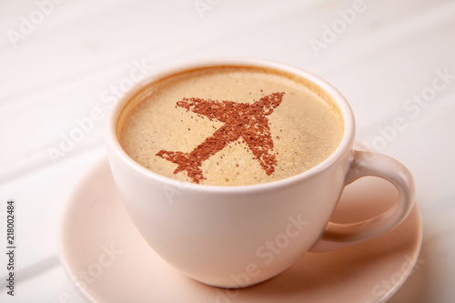 Cup of coffee with airplane on foam Morning coffee