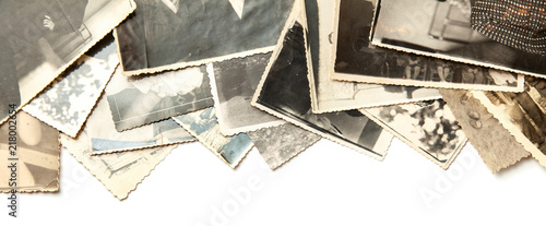 Stack old photos isolated on white background. Postcard rumpled and dirty vintage