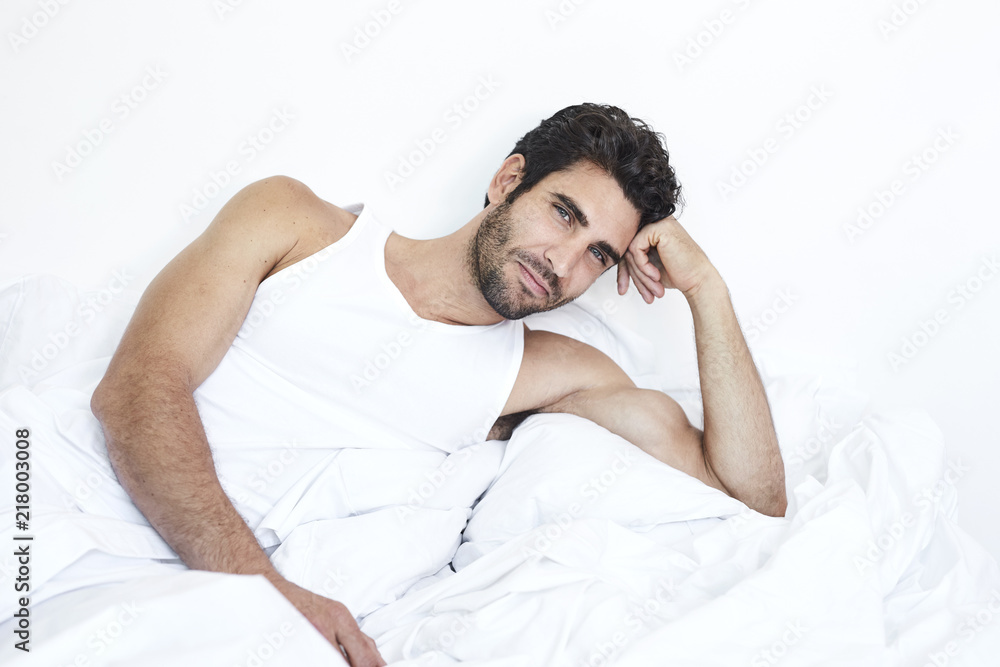 Dude relaxing in bed, portrait Dude relaxing in bed, portrait