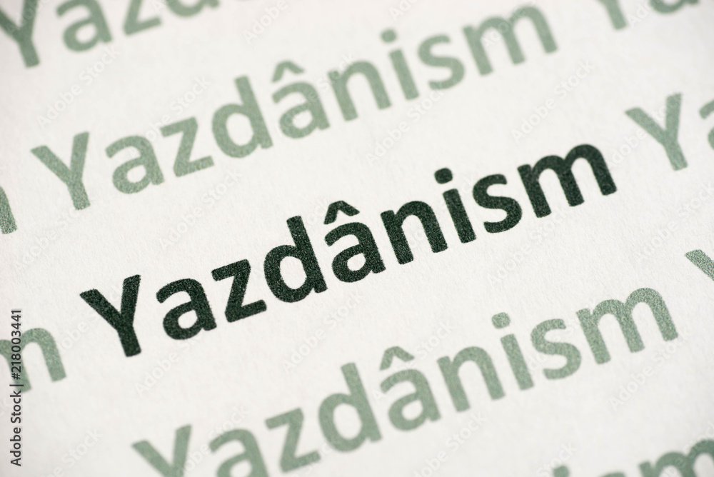 word Jazdanism printed on paper macro