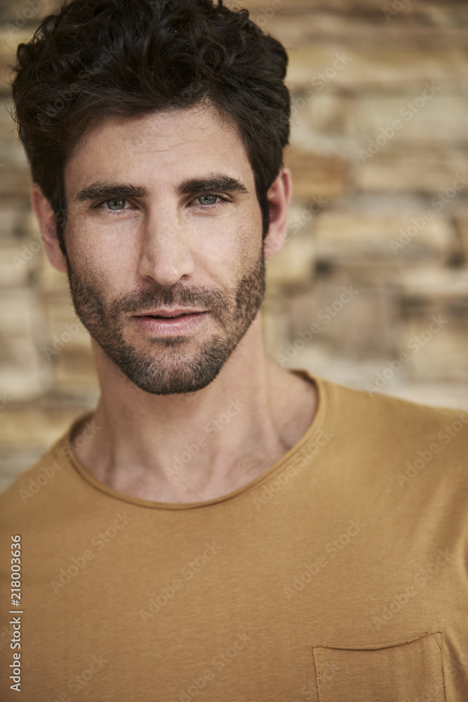 Fototapeta premium Handsome young man with stubble, portrait