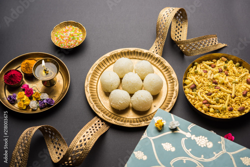 Raksha bandhan Festival : conceptual Rakhi made using plate full of Rasgulla sweet with band. A traditional Indian wrist band which is a symbol of love between Brothers and Sisters photo