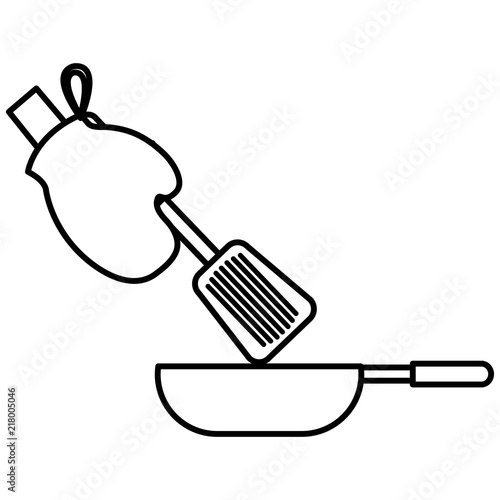 glove kitchen with pan and spatule