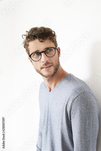 Guy in grey top and glasses, looking away © sanneberg
