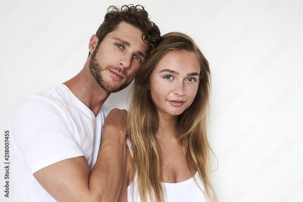 Blue eyed couple in white studio, portrait Blue eyed couple in white studio, portrait