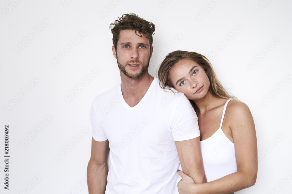 Fototapeta premium Good looking couple in white, portrait