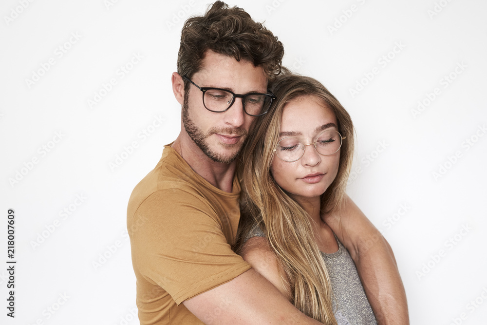 Glasses couple together in studio