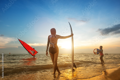 water sport on family join together playing in the sea, surfboard and windsurf for summer time holidays vacation on trip of family enjoy