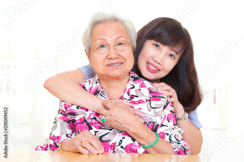 Asian senior womanand daughter photo