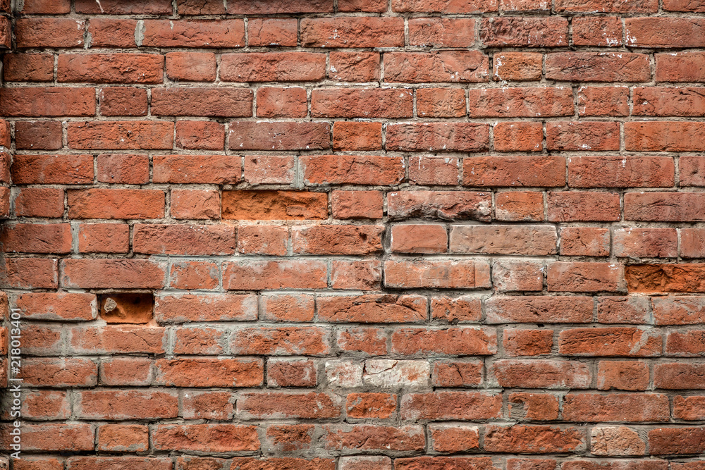 Obraz premium Red old brick wall of an building, background texture of a brick