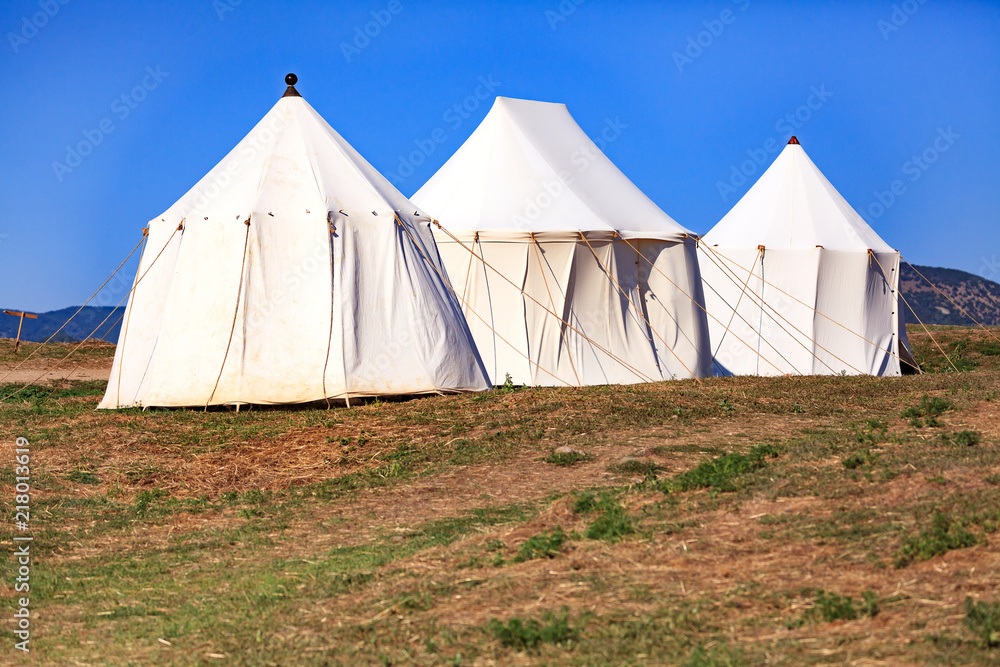 Three tents under the blue sky