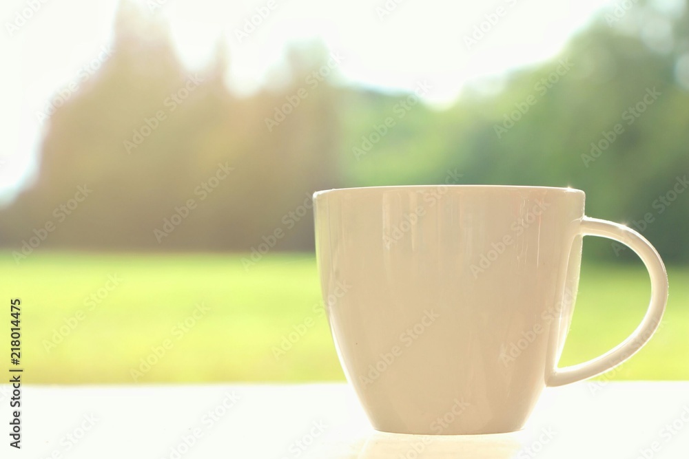 coffee cup with on nature Morning background.