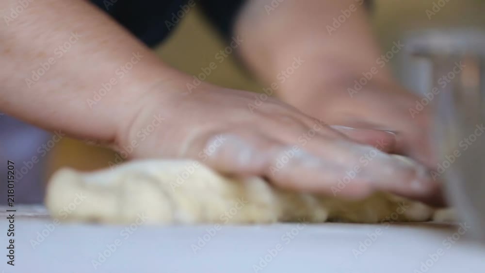 Woman cooking shoti, rolling dough, baking in tone, traditional Georgian bread Woman cooking shoti, rolling dough, baking in tone, traditional Georgian bread