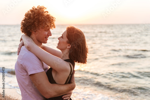 Portrait of a smiling young couple hugging © Drobot Dean