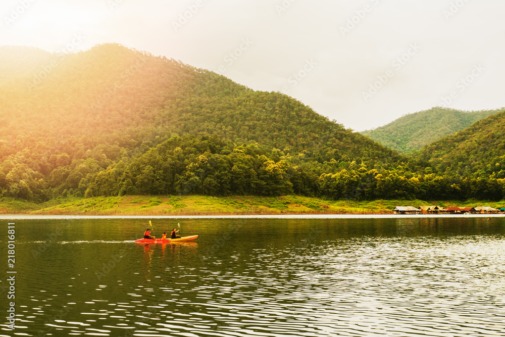 Family kayaking in the lake