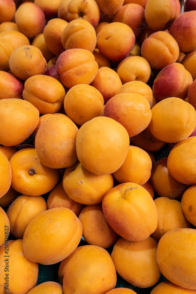 Orange Apricots a pile at the market, fresh and sweet