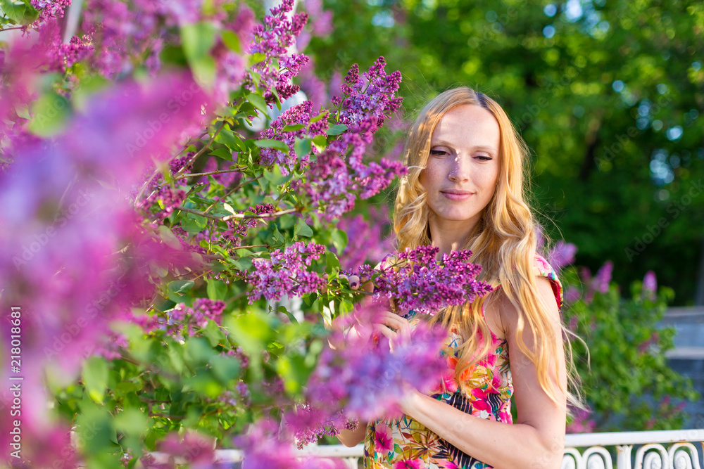 Model in garden with lilac Model in garden with lilac