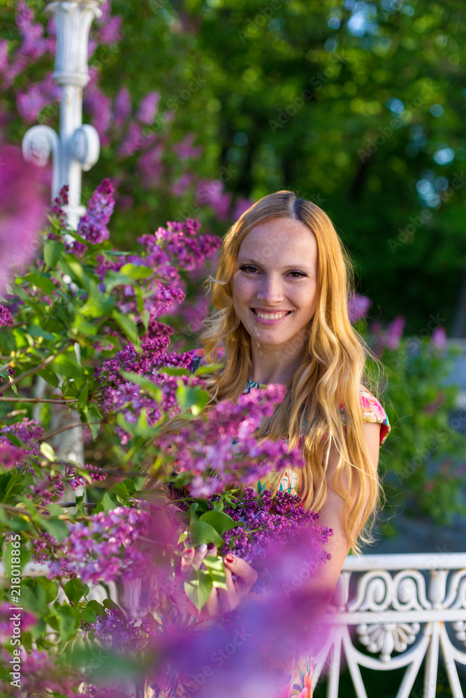 Model in garden with lilac Model in garden with lilac