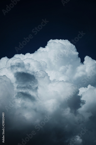 Thunder clouds in the dark blue sky