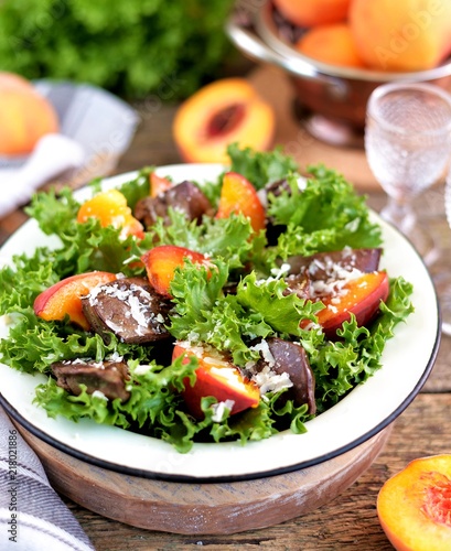 Salad with fried turkey liver, peaches, parmesan, olive oil and balsamic vinegar.