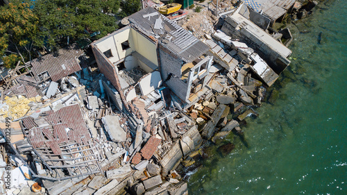 The destroyed house after the earthquake on the seashore