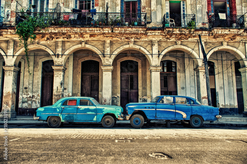 view of a street in Havana with old cars parked © javier