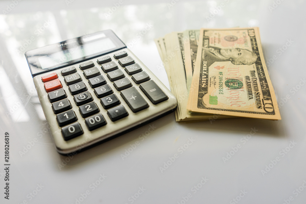 Close-up Money and Calculator, American Dollar Banknotes Close-up Money and Calculator, American Dollar Banknotes