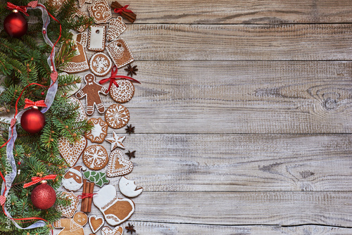 Christmas Holiday Background with copy space. Homemade cookies, Christmas fir, tree and Christmas spices.
