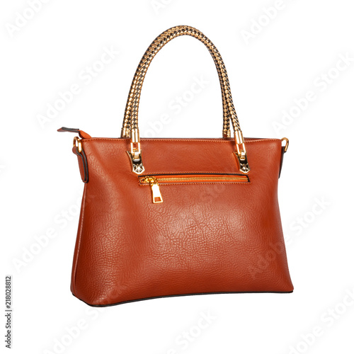 Orange matt leather bag with glitter with gold handles and accessories isolated on white background