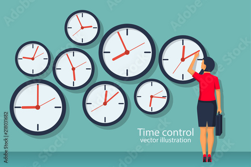 Time control concept. Organization of process. Vector illustration flat design. Isolated on background. Businesswoman standing at wall with clock adjusts time. photo