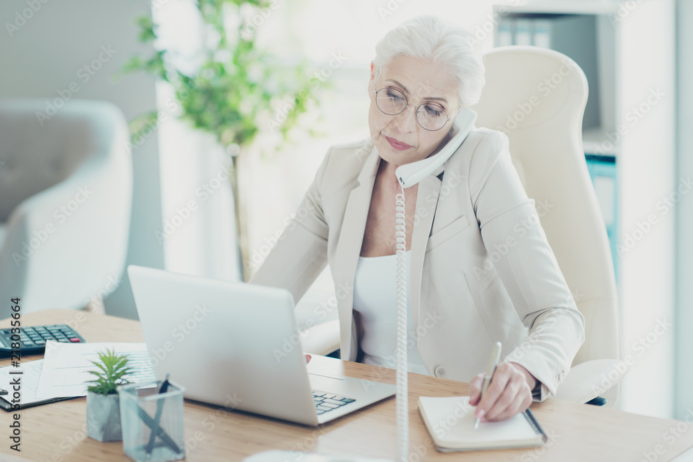 Grey-haired beautiful stylish old serious lady executive worker Grey-haired beautiful stylish old serious lady executive worker