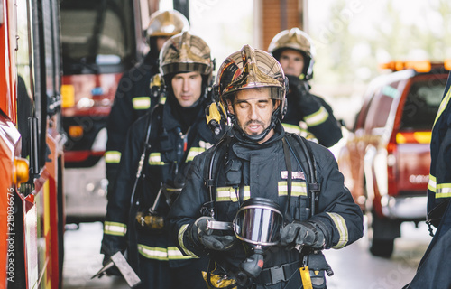 Firemen working at fire station.