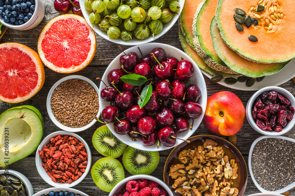 Selection of food, fresh fruits and vegetables, berries, nuts and seeds. Healthy eating concept Selection of food, fresh fruits and vegetables, berries, nuts and seeds. Healthy eating concept