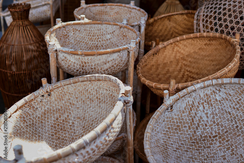 Many kind of basket that are made of bamboo. Basket wicker handmade. Traditional  bamboo texture. Handmade  wickerwork products for sale. Handcraft concept. photo