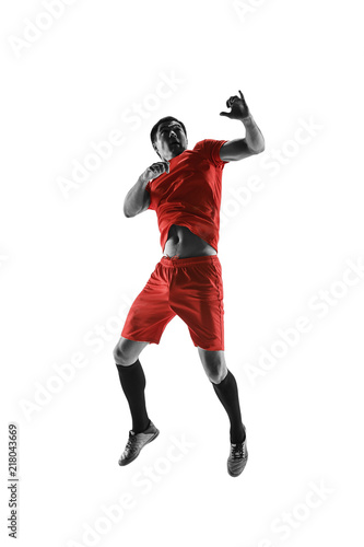 Professional football soccer player in motion isolated on white studio background