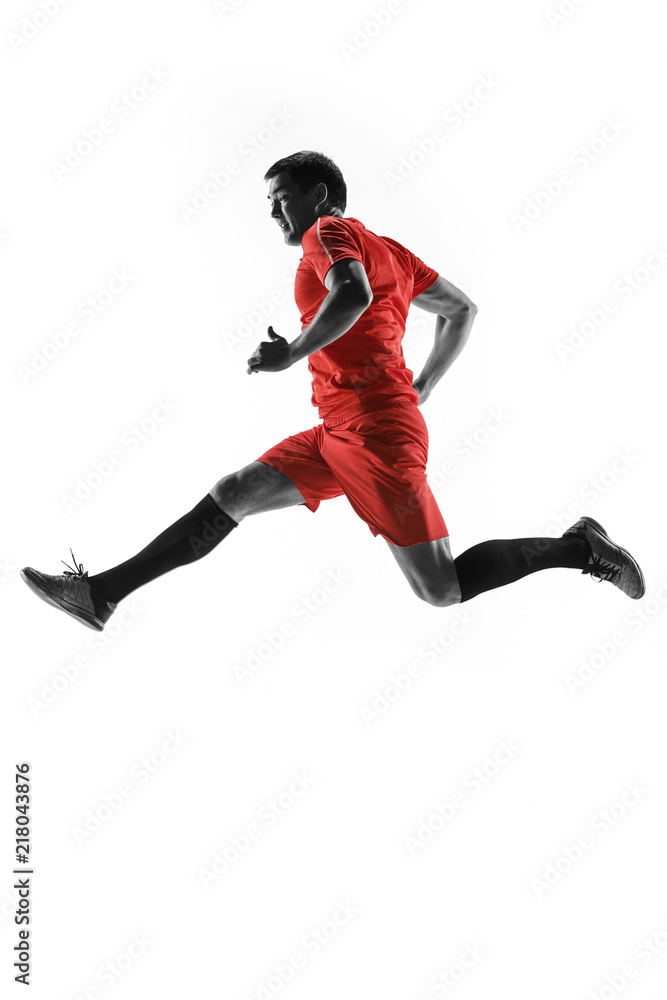 Professional football soccer player in motion isolated on white studio background