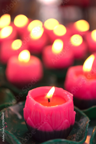 Flower candles burning at night.