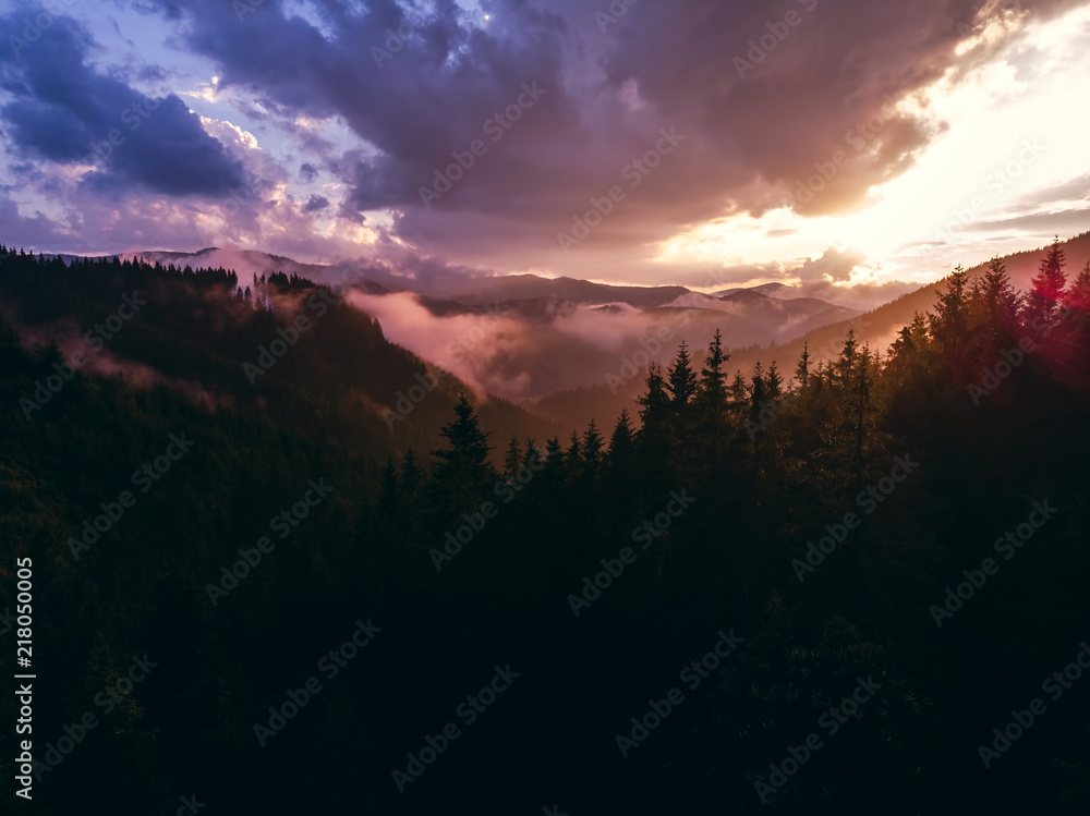 beautiful aerial view of the mountains and the blue lake, the sunset after the rain, the coniferous forest, the purple clouds, Best place in, tourism and nature concept, the Carpathians Ukraine