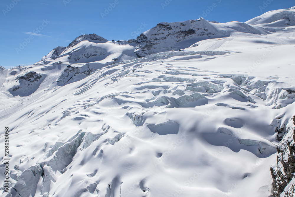Snow-covered glacier in a Mountains of Saas-Fee in Switzerland