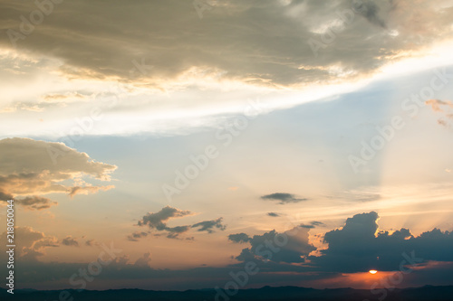 colorful dramatic sky with cloud at sunset.