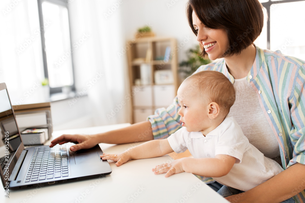 multi-tasking, freelance and motherhood concept - working mother baby boy and laptop computer at home office multi-tasking, freelance and motherhood concept - working mother baby boy and laptop computer at home office