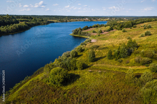 Bird's eye view of the Oyat river and green fields of Vepsia, the border with Karelia and Leningrad oblast, Russia.