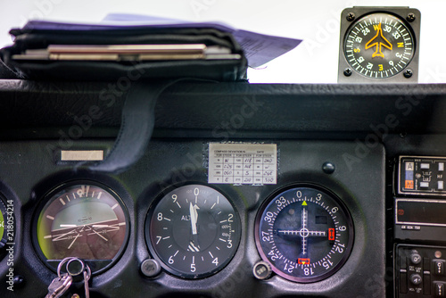 Detail of old airplane cockpit. Aircraft equipment, various indicators, buttons, instruments. The flight desk and control panel during take off and landing. Aircraft dashboard panel in pilot school