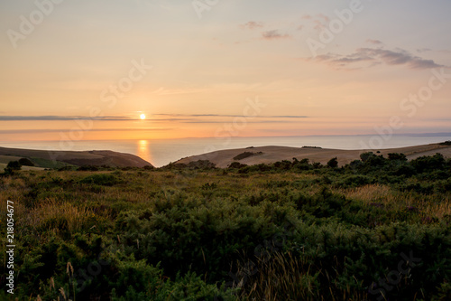 Sunset over the ocean from the beautiful nature of Exmoor